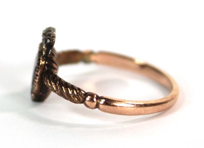 Lot 523 - A 19th century yellow metal ring set heart...