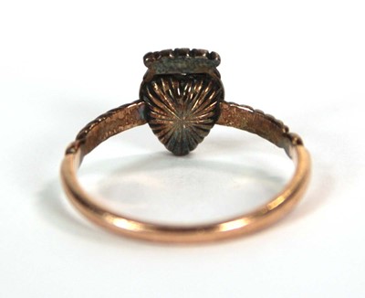 Lot 523 - A 19th century yellow metal ring set heart...