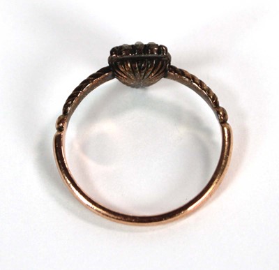 Lot 523 - A 19th century yellow metal ring set heart...