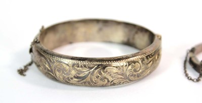 Lot 526 - An Edwardian narrow engraved silver hinged...