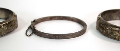 Lot 526 - An Edwardian narrow engraved silver hinged...