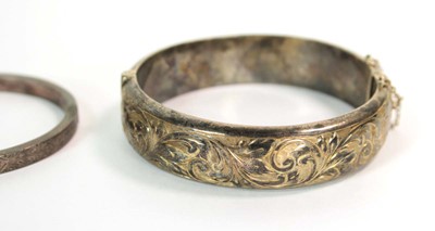 Lot 526 - An Edwardian narrow engraved silver hinged...