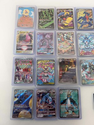 Lot 1402 - Approx. 25 Top Loaded Pokémon cards from...
