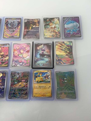 Lot 1407 - Approx. 25 Top Loaded Pokémon cards from...