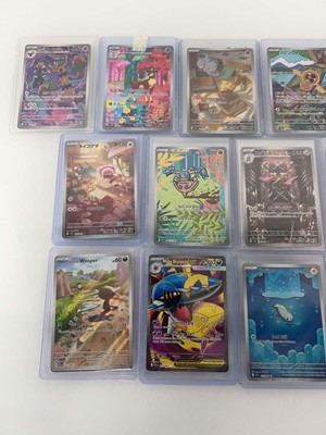 Lot 1408 - Approx. 25 Top Loaded Pokémon cards from...