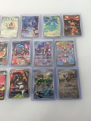 Lot 1408 - Approx. 25 Top Loaded Pokémon cards from...