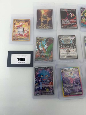 Lot 1409 - Approx. 25 Top Loaded Pokémon cards from...