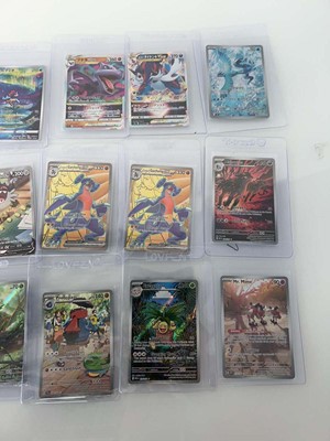 Lot 1409 - Approx. 25 Top Loaded Pokémon cards from...