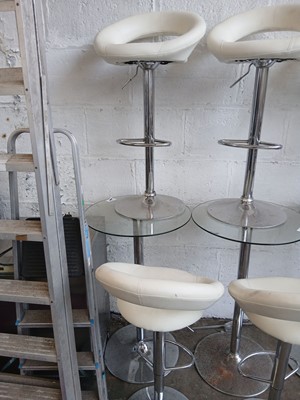 Lot 595 - Glasstop circular poseur table with 2 cream...