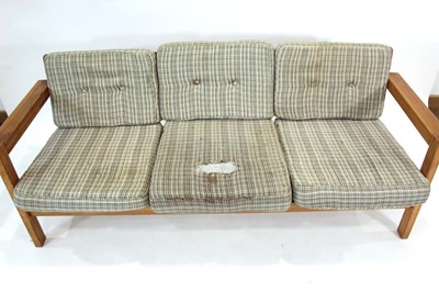 Lot 19 - A 1970's pine three-seater sofa on square...