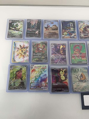 Lot 1413 - Approx. 25 Top Loaded Pokémon cards from...