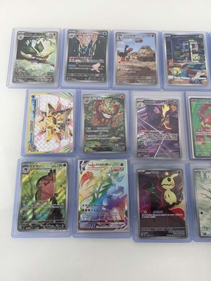 Lot 1413 - Approx. 25 Top Loaded Pokémon cards from...