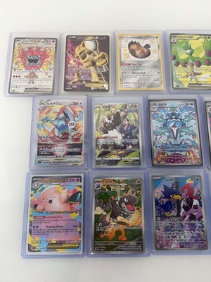 Lot 1414 - Approx. 25 Top Loaded Pokémon cards from...