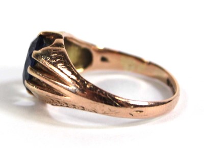 Lot 530 - A 9ct rose gold ring set oval synthetic...