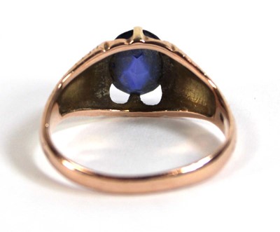 Lot 530 - A 9ct rose gold ring set oval synthetic...