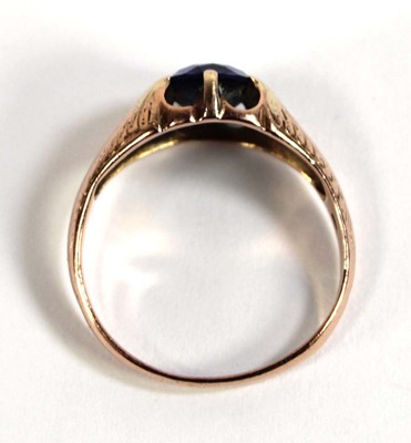 Lot 530 - A 9ct rose gold ring set oval synthetic...