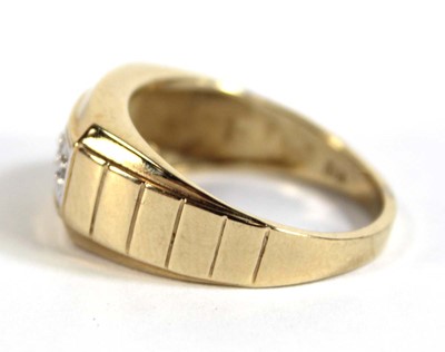 Lot 531 - A 9ct yellow gold ring set fur small diamonds...