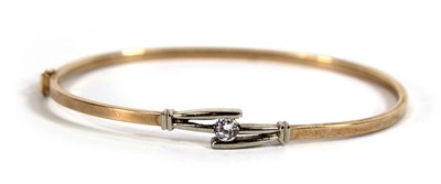 Lot 537 - A 9ct yellow gold hinged bracelet set paste,...