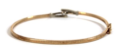 Lot 537 - A 9ct yellow gold hinged bracelet set paste,...