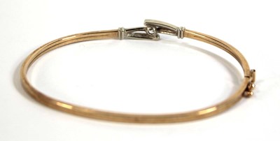 Lot 537 - A 9ct yellow gold hinged bracelet set paste,...