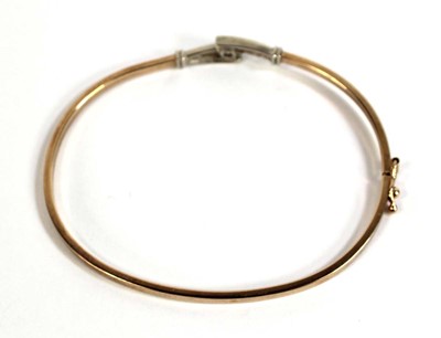Lot 537 - A 9ct yellow gold hinged bracelet set paste,...