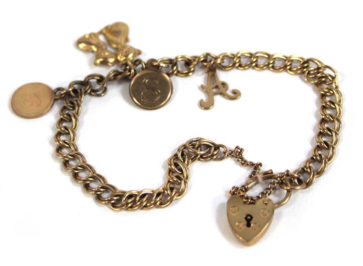 Lot 542 - A 9ct yellow gold double curblink bracelet...
