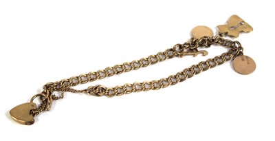 Lot 542 - A 9ct yellow gold double curblink bracelet...