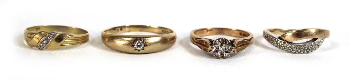 Lot 547 - Four 9ct yellow gold rings, each set diamonds...