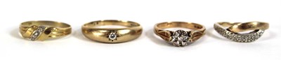 Lot 547 - Four 9ct yellow gold rings, each set diamonds...