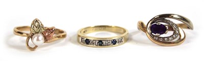 Lot 548 - Three 9ct yellow gold rings including one set...