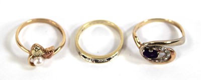Lot 548 - Three 9ct yellow gold rings including one set...