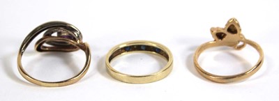 Lot 548 - Three 9ct yellow gold rings including one set...