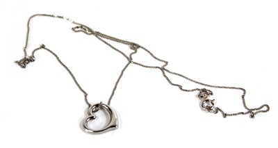 Lot 549 - A 9ct white gold finelink necklace suspending...
