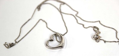Lot 549 - A 9ct white gold finelink necklace suspending...