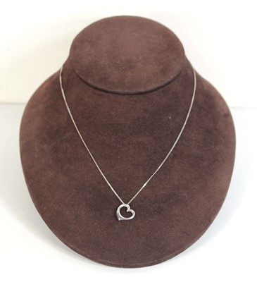 Lot 549 - A 9ct white gold finelink necklace suspending...