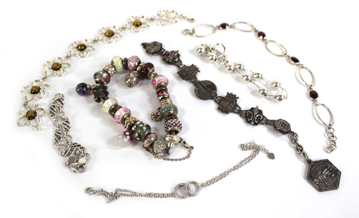 Lot 554 - Seven silver and metalware bracelets including...
