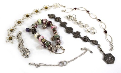 Lot 554 - Seven silver and metalware bracelets including...