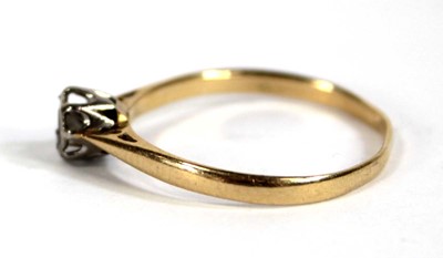 Lot 556 - An 18ct yellow gold ring set small diamond in...