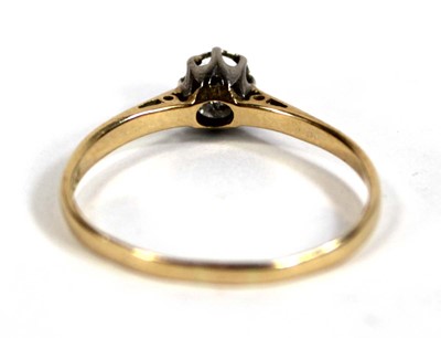 Lot 556 - An 18ct yellow gold ring set small diamond in...