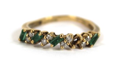 Lot 557 - An 18ct yellow gold half eternity ring set...