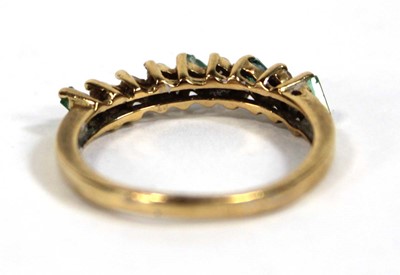 Lot 557 - An 18ct yellow gold half eternity ring set...