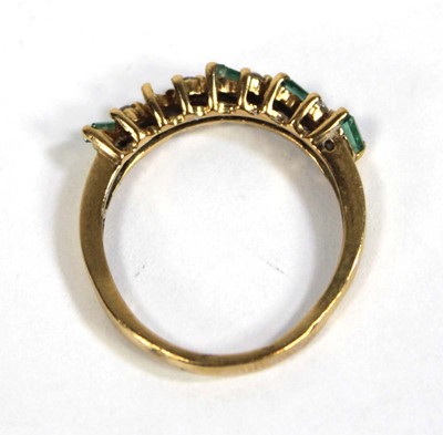 Lot 557 - An 18ct yellow gold half eternity ring set...