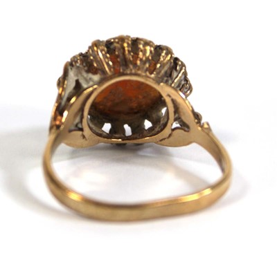 Lot 558 - A 9ct yellow gold ring set circular cameo,...