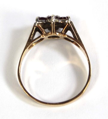 Lot 559 - A 9ct yellow gold cluster ring set small...