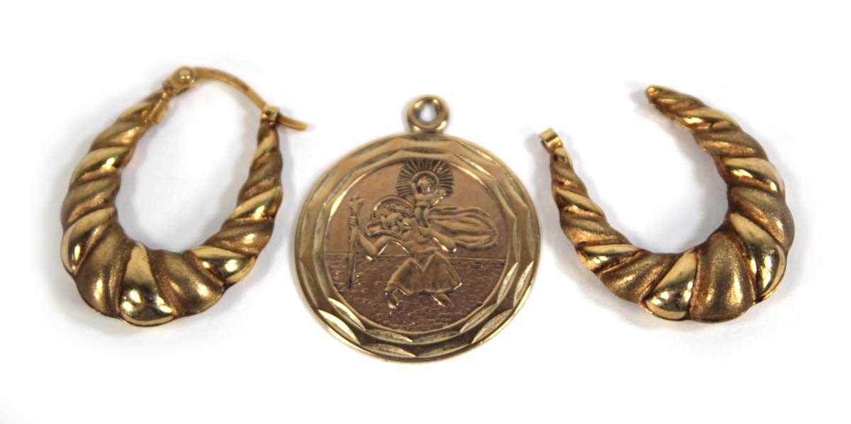 Lot 561 - A 9ct yellow gold St Christopher pendant,...