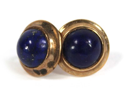 Lot 565 - A pair of 9ct yellow gold ear studs, each set...