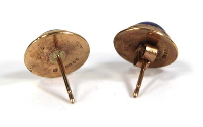 Lot 565 - A pair of 9ct yellow gold ear studs, each set...