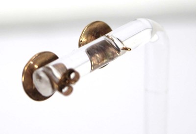 Lot 565 - A pair of 9ct yellow gold ear studs, each set...