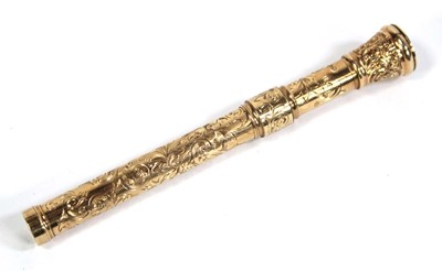 Lot 567 - A yellow metal scroll engraved propelling...