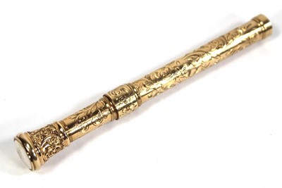 Lot 567 - A yellow metal scroll engraved propelling...